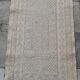 Hand-woven rug in natural wool