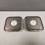 A set of classic Danish candlesticks in polished metal.