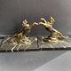 Pair of art deco marble and patinated regulated bookends
