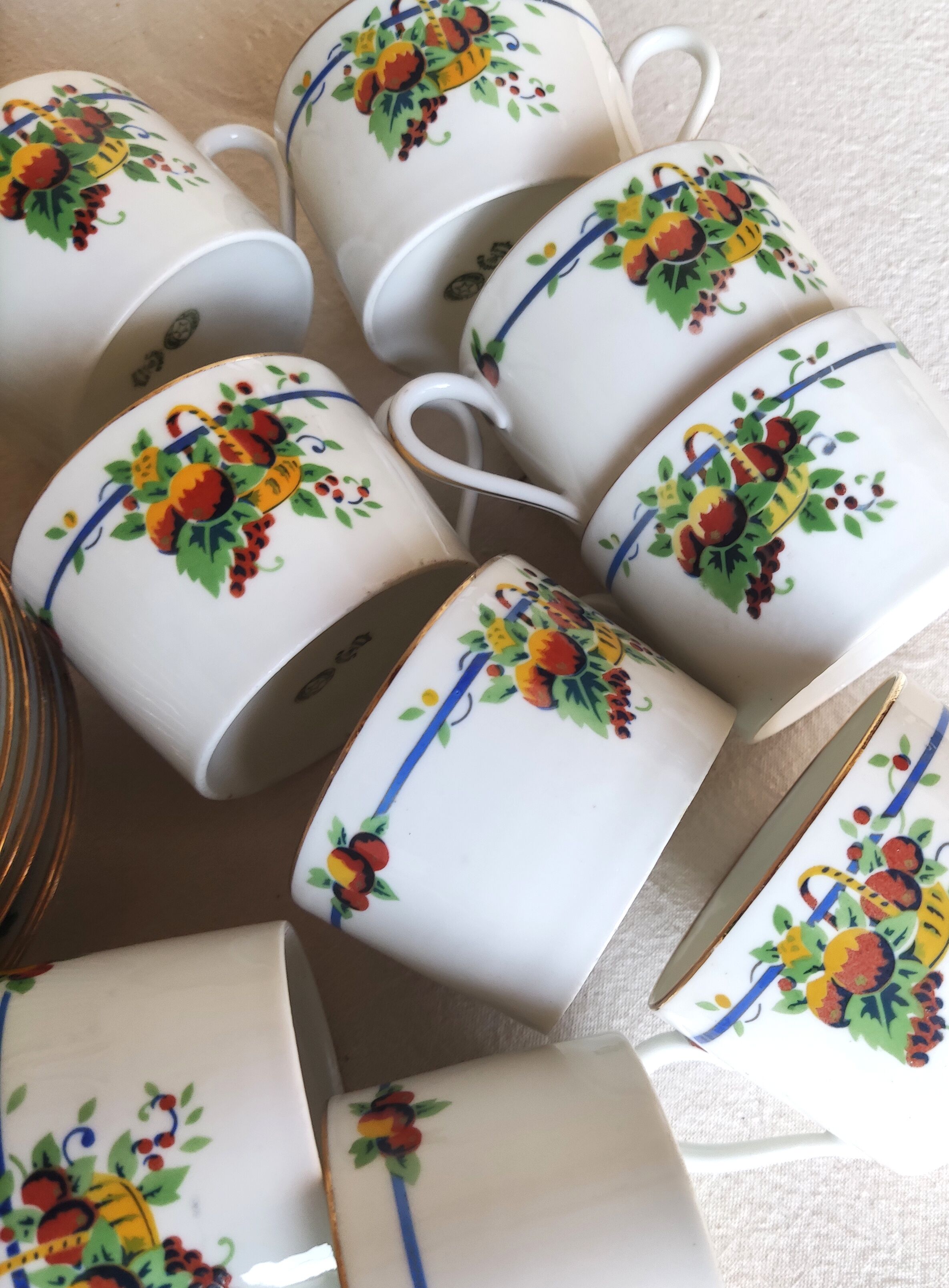 10 tea cups and creamer in Limoges porcelain