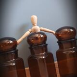 Trio round brown apothecary bottles