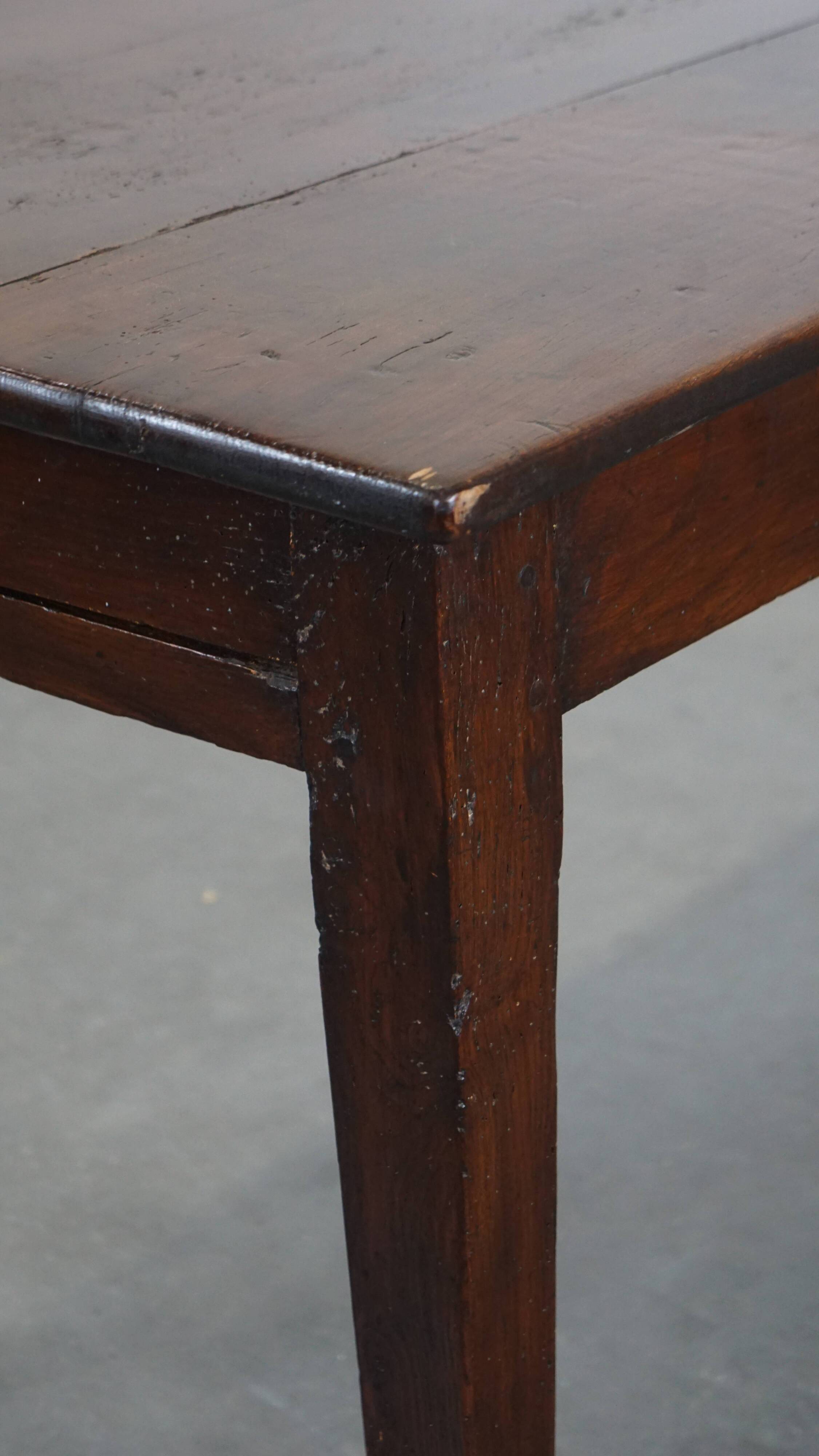 Antique French fruitwood dining table with 2 drawers and patina