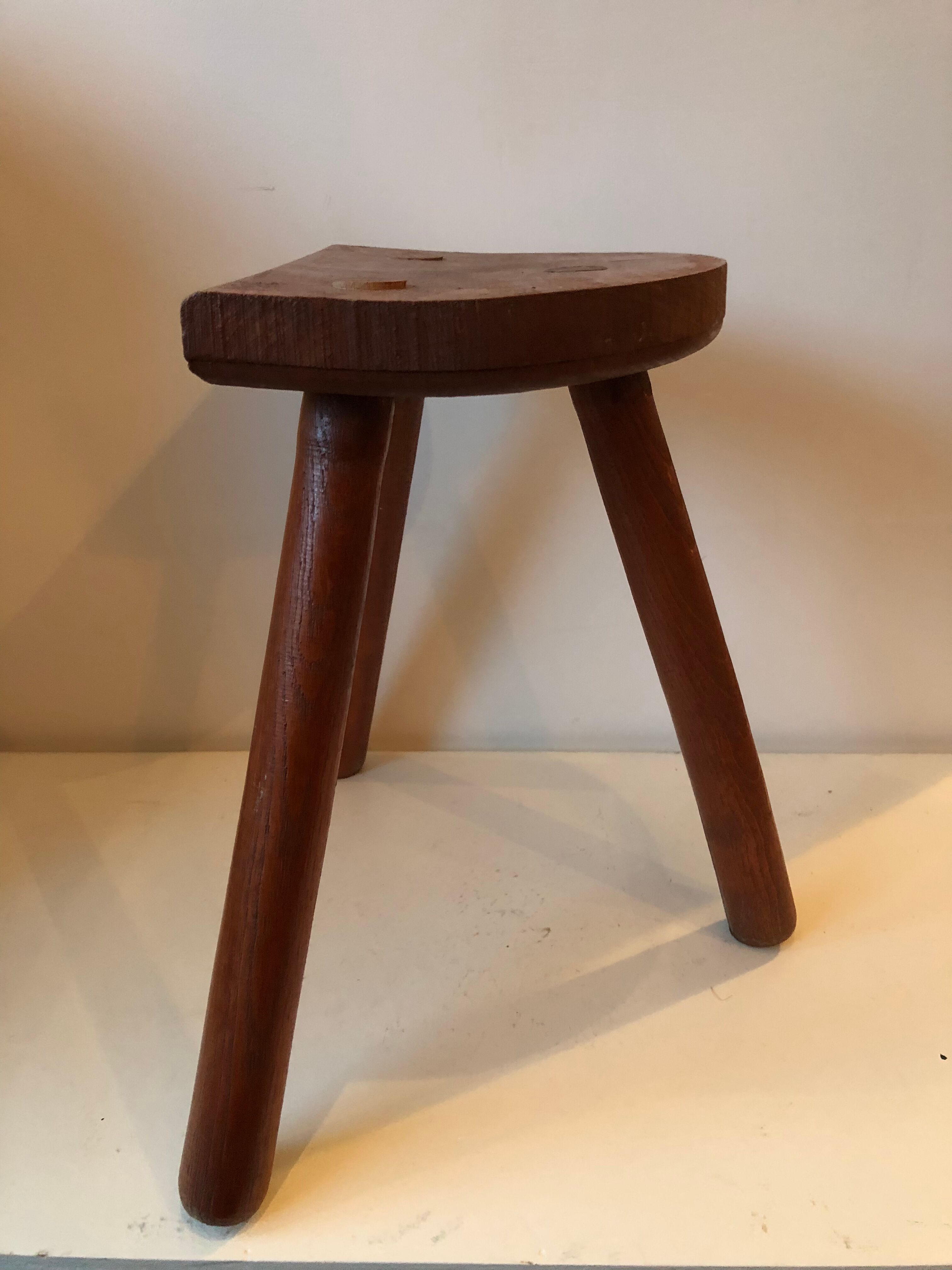 Old wooden tripod stool