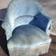 Blue velvet toad chair with fringes and pom poms