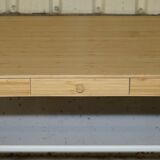 Small bamboo desk with three drawers.