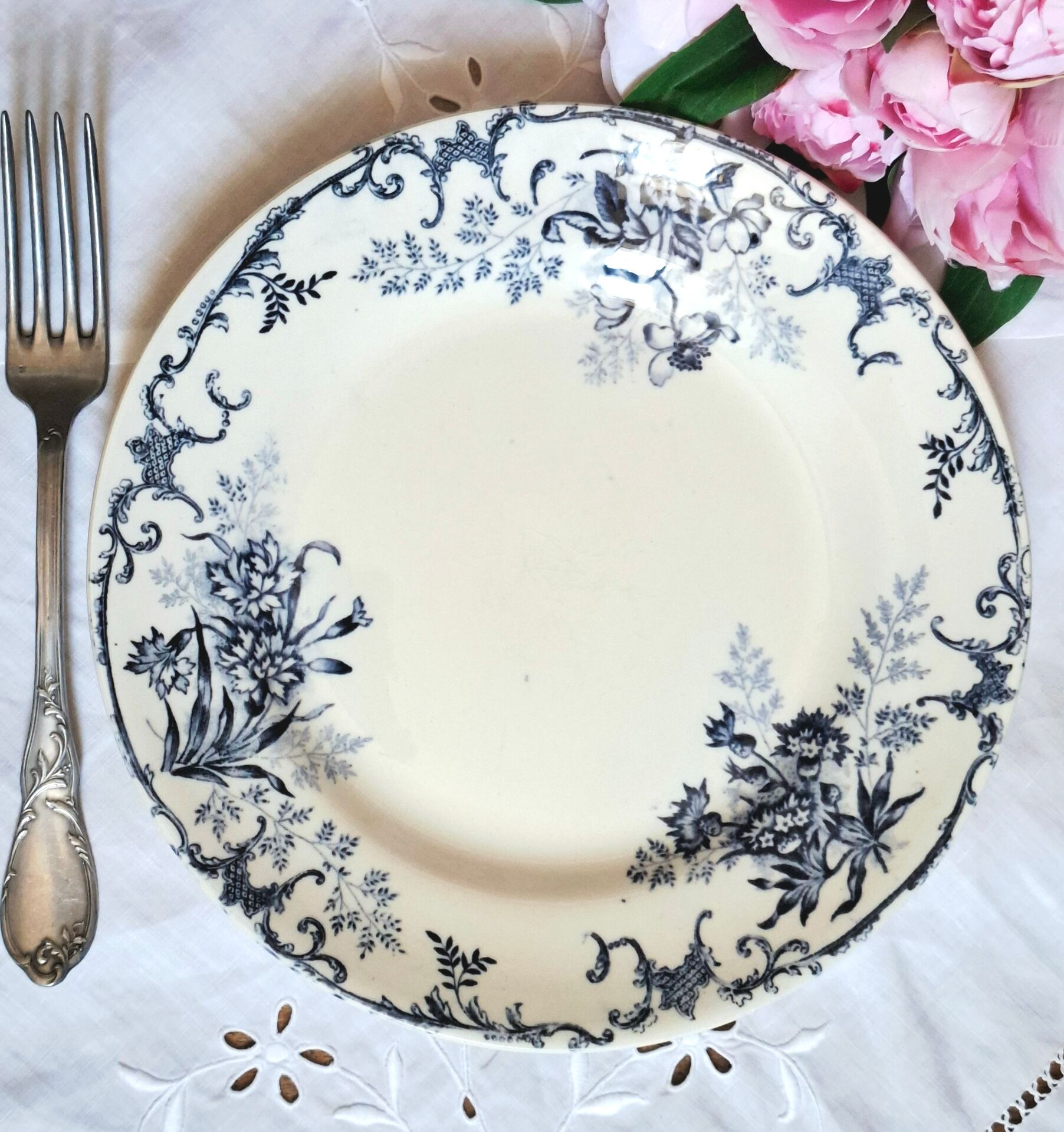 Old mismatched flat plates made of ironstone earthenware.