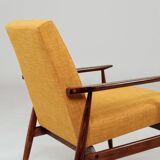 Vintage amber armchair Hermes designed by H. Lis