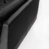 Black leather two-seater sofa. Roche Bobois edition. France, 1980s.