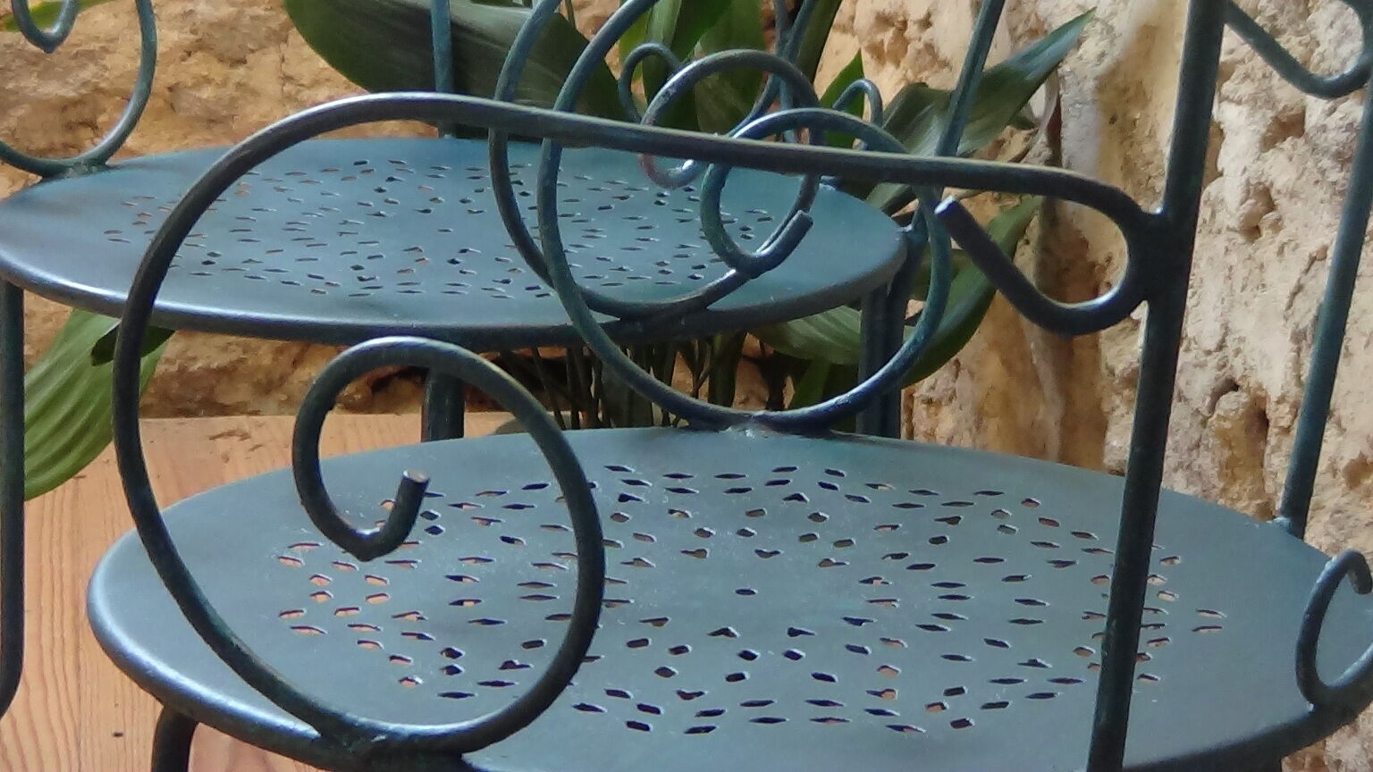 A pair of metal garden chairs