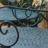 A pair of metal garden chairs