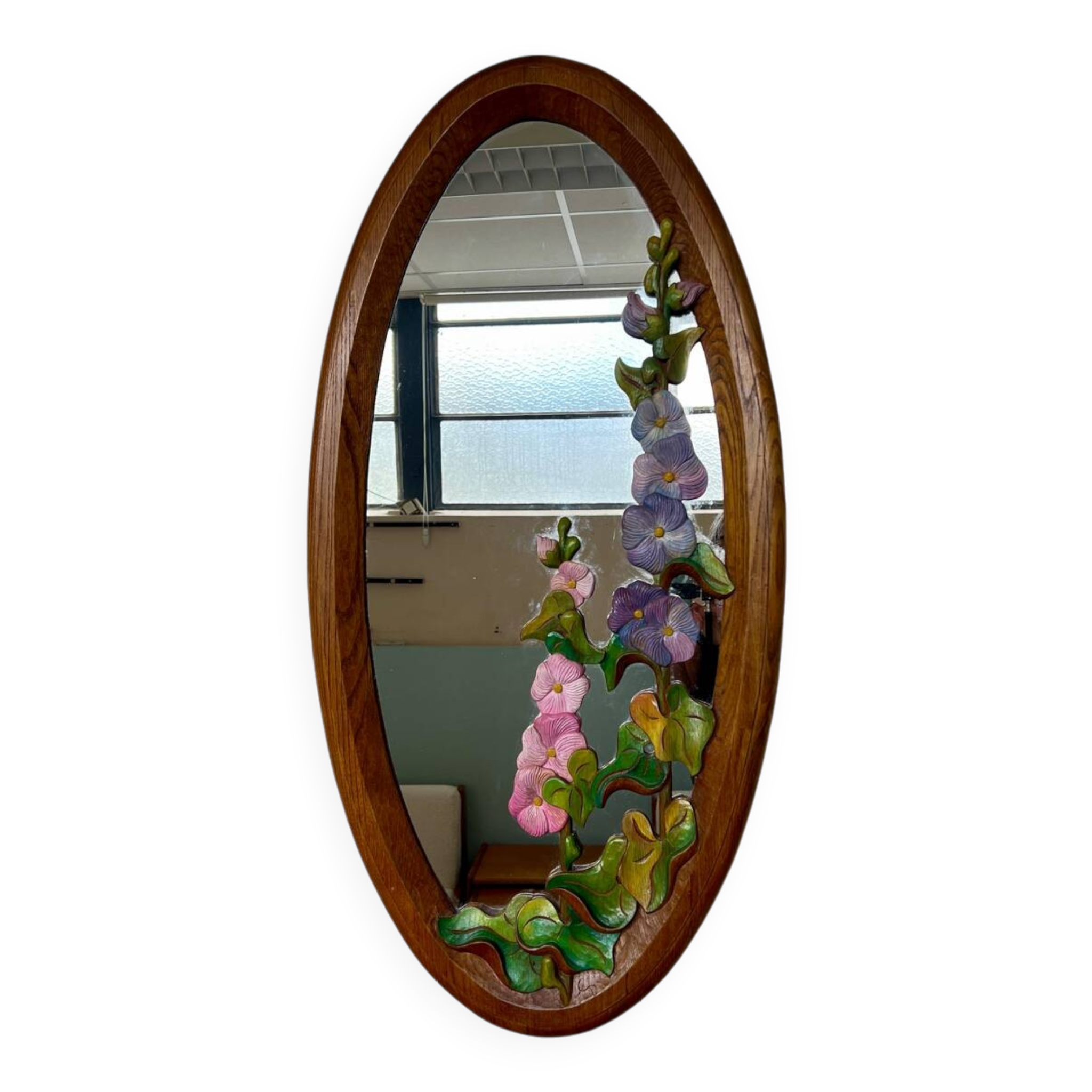 Carved wooden mirror with flower decorations.
