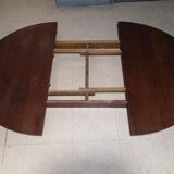 Scandinavian extendable round dining table in teak