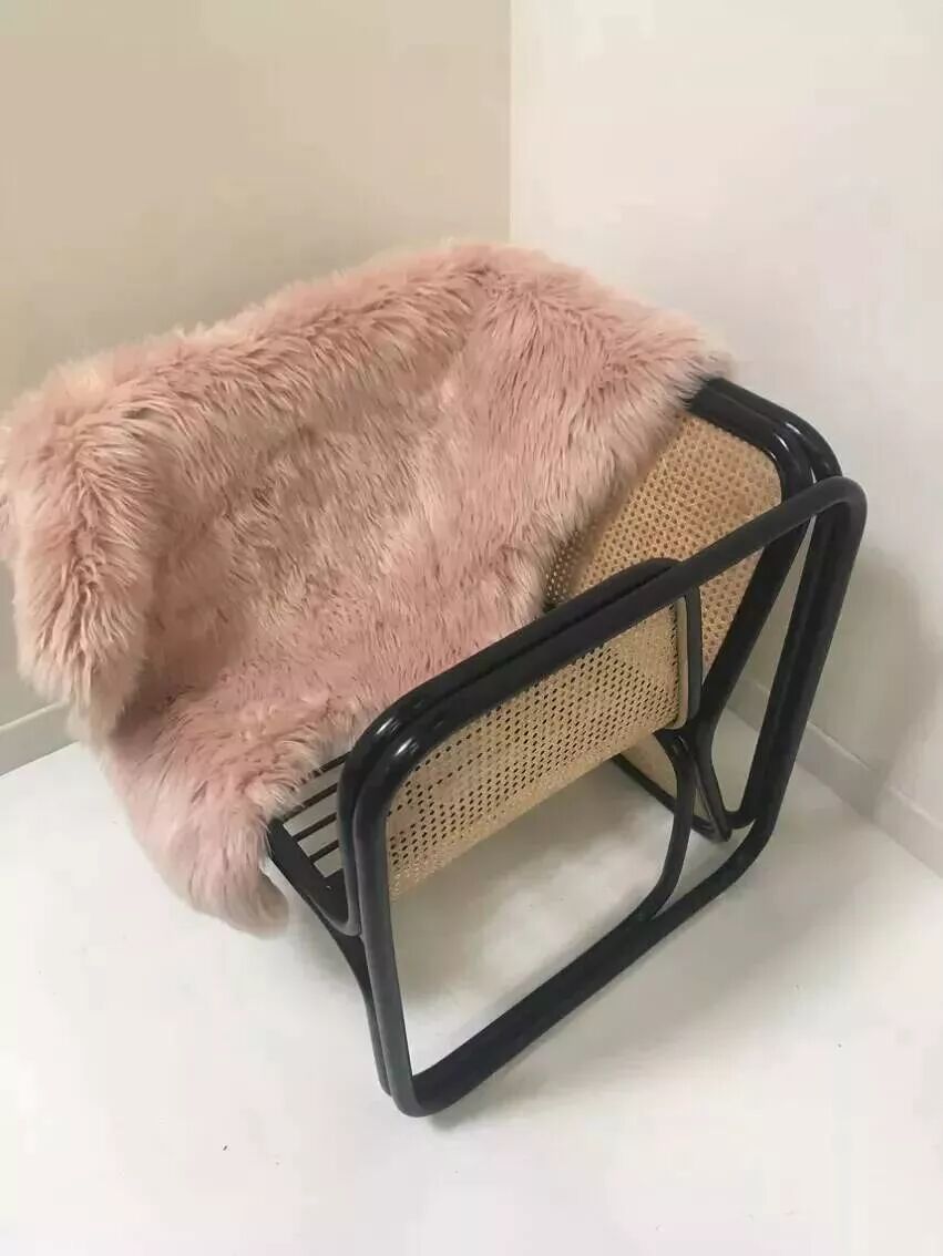 Armchair in black lacquered rattan and natural cane