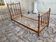 Child's bed or vintage rest bed made of solid cherry wood in a bamboo style.