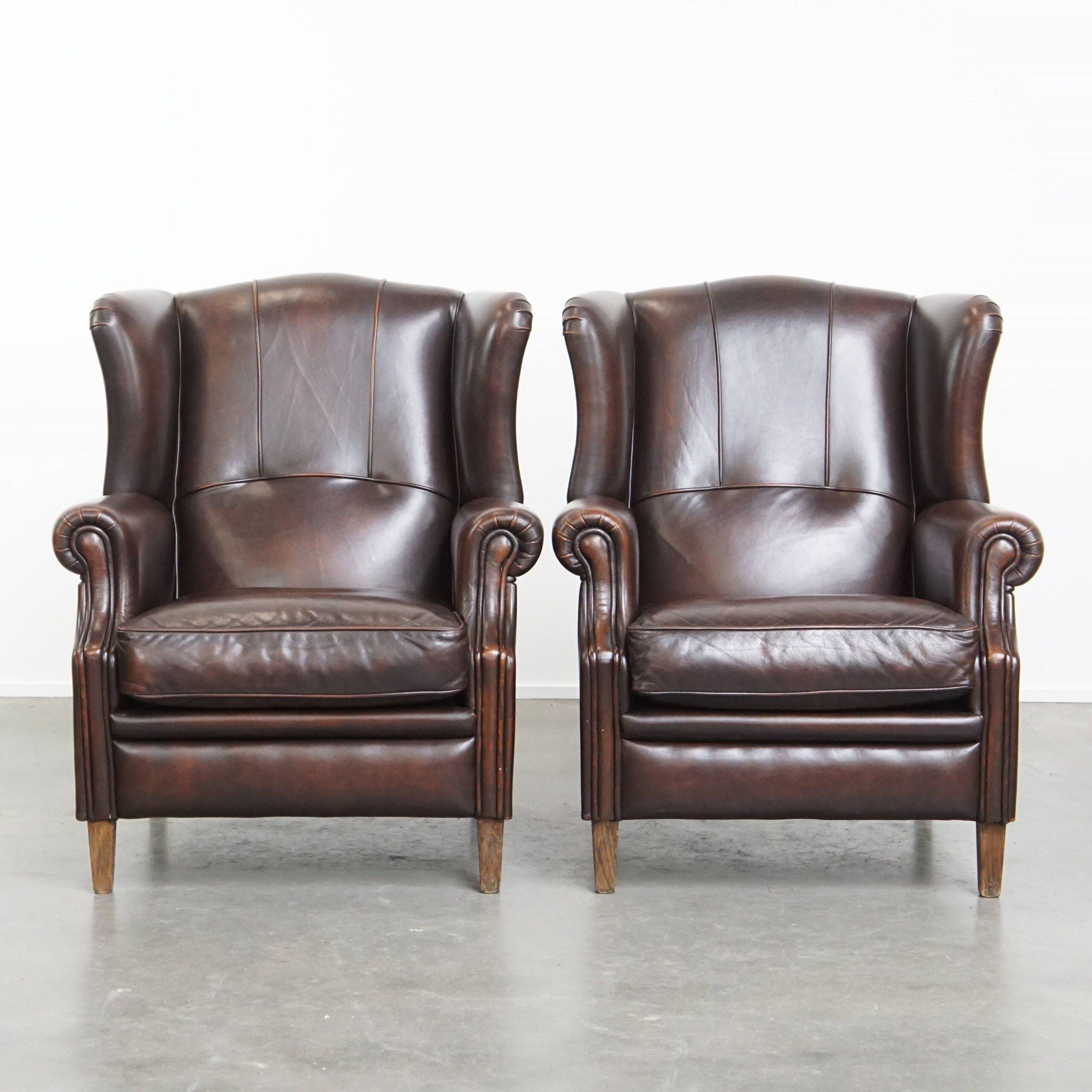 Comfortable and very beautiful set of 2 cow leather wingback armchairs in English style