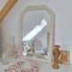 Miroir biseauté et mouluré beige