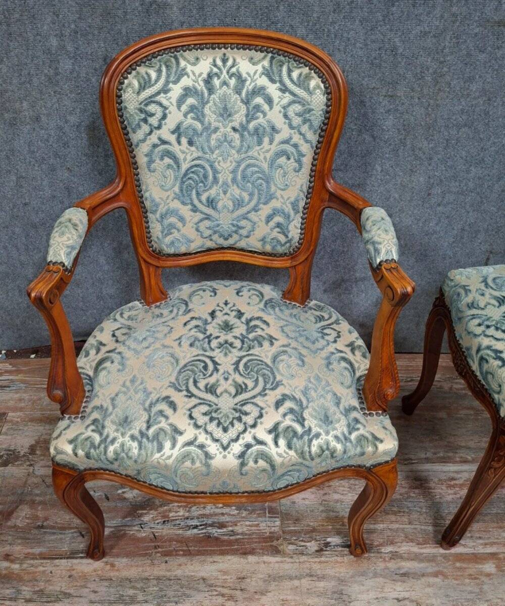 Cabriolet armchair in cherry wood with its footrest, 20th century.