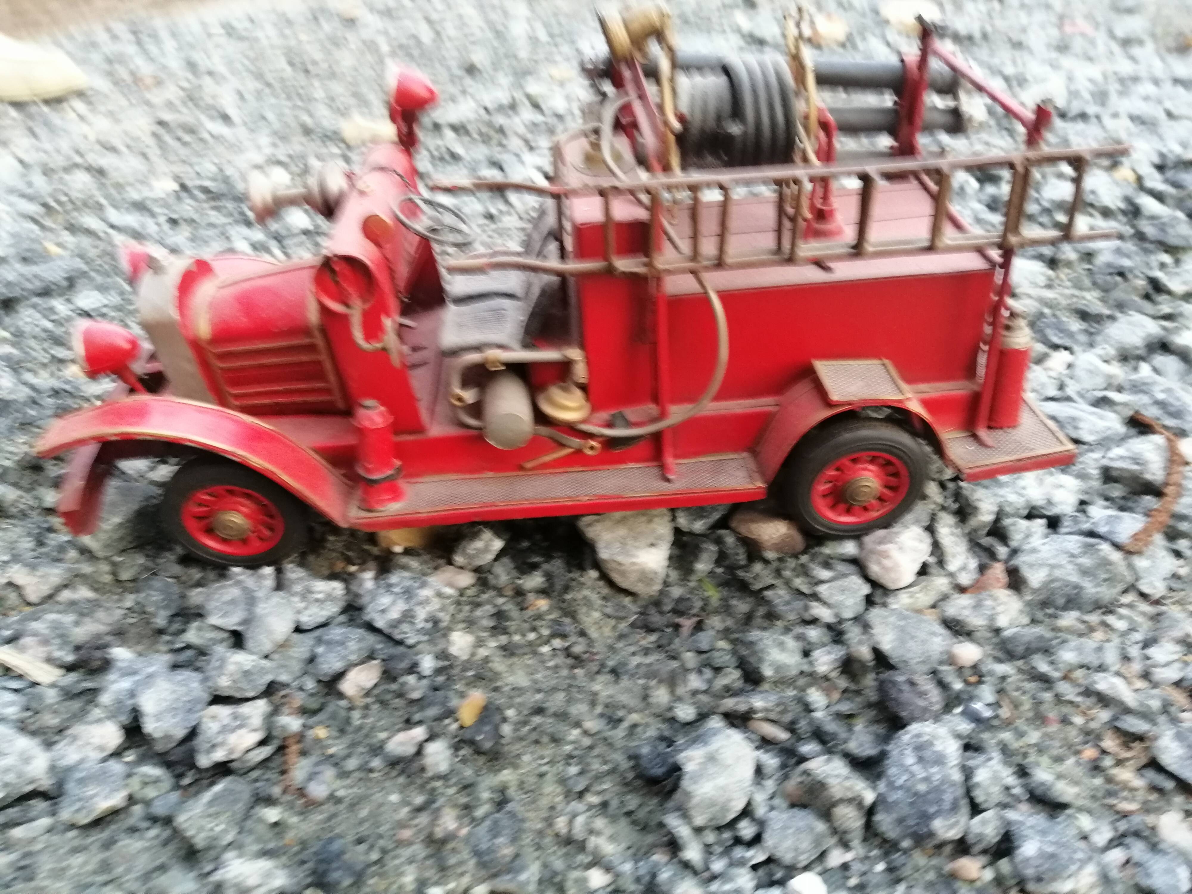 American fire truck from 1930 in sheet steel with all its water lance accessories,