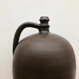 Ancient varnished sandstone jug