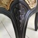 Black baroque armchair with fabric designed by wildlife by Ascension Latorre, Spain