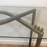 Console en acier brossé et laiton et plateau formé d'une dalle de verre. Travail français. Vers 1970