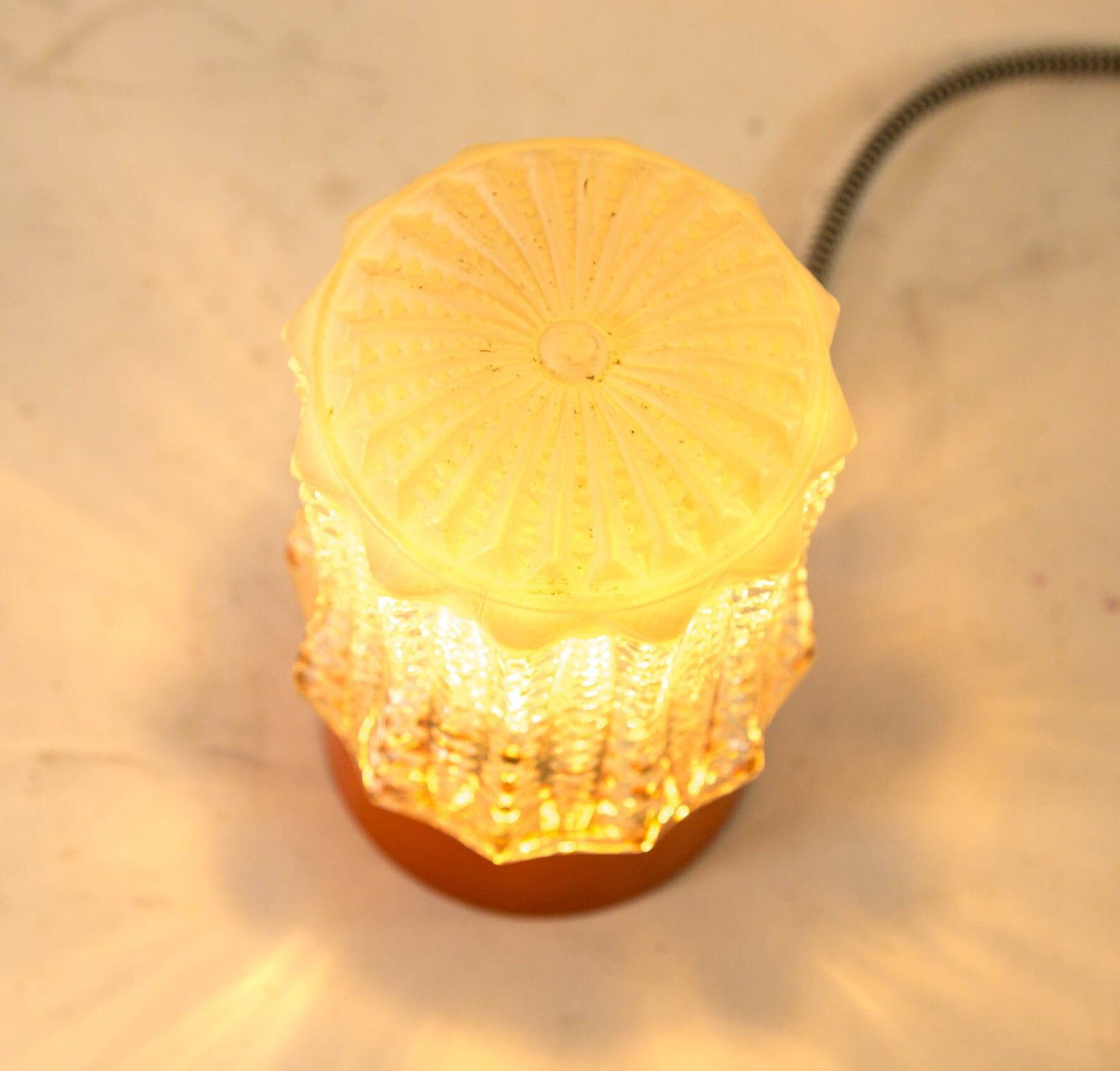 Built-in glass dome and vintage round orange base from the 70s