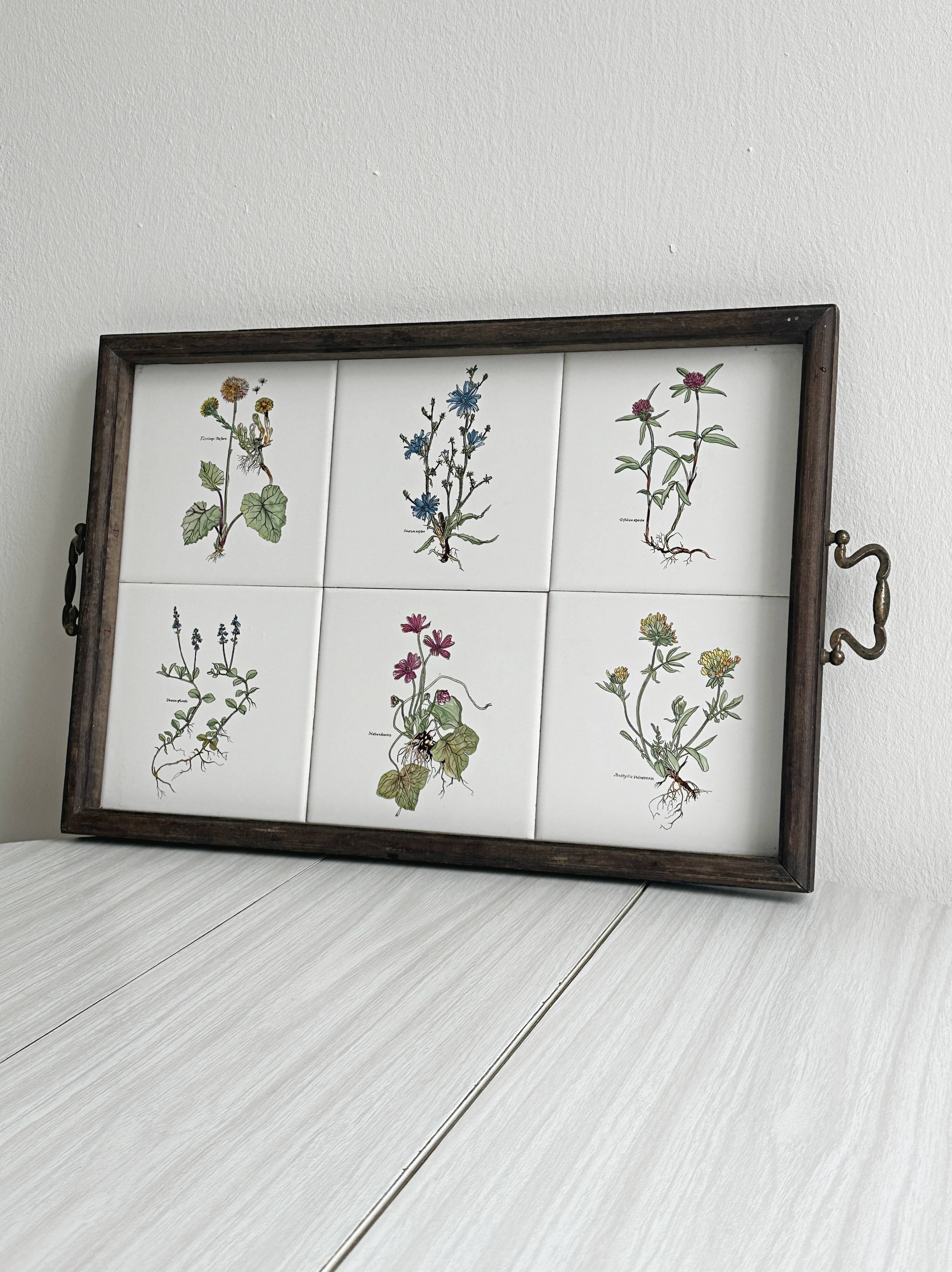 Old wooden plateau with floral tiles