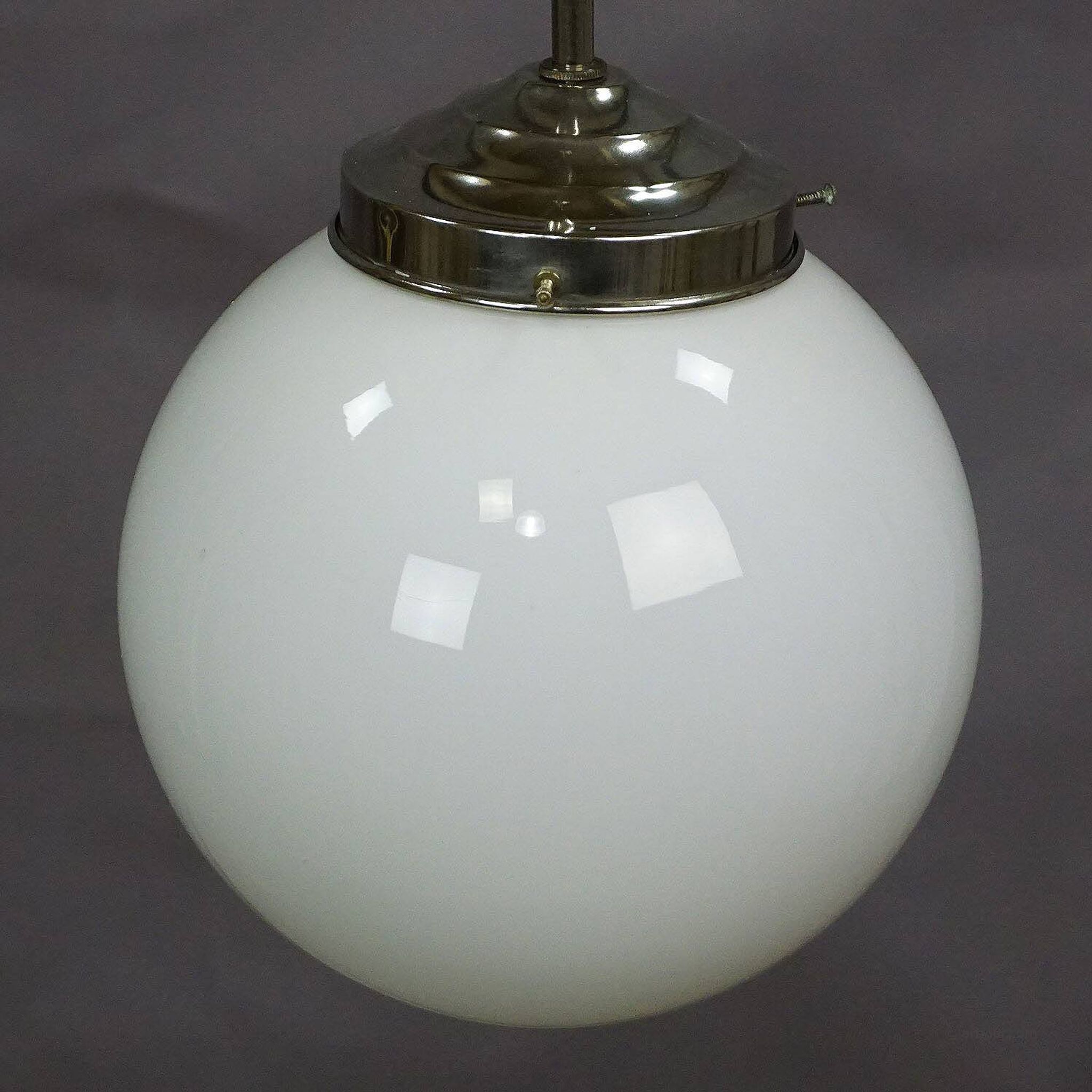 Functional Bauhaus-style pendant light with opaline glass shade.