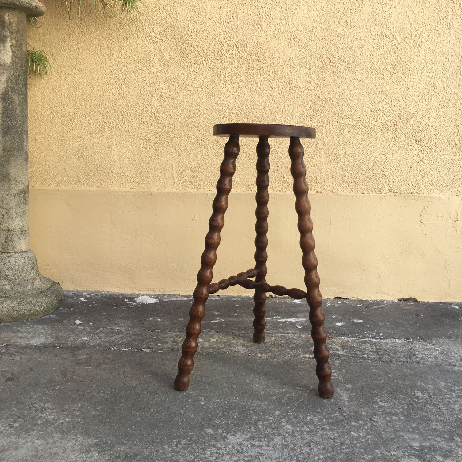High tripod stool.