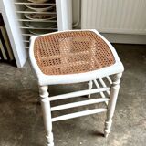 White wooden stool with caning