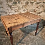 Vintage French pine table with extendable side, circa 1930, suitable for kitchen or office use.