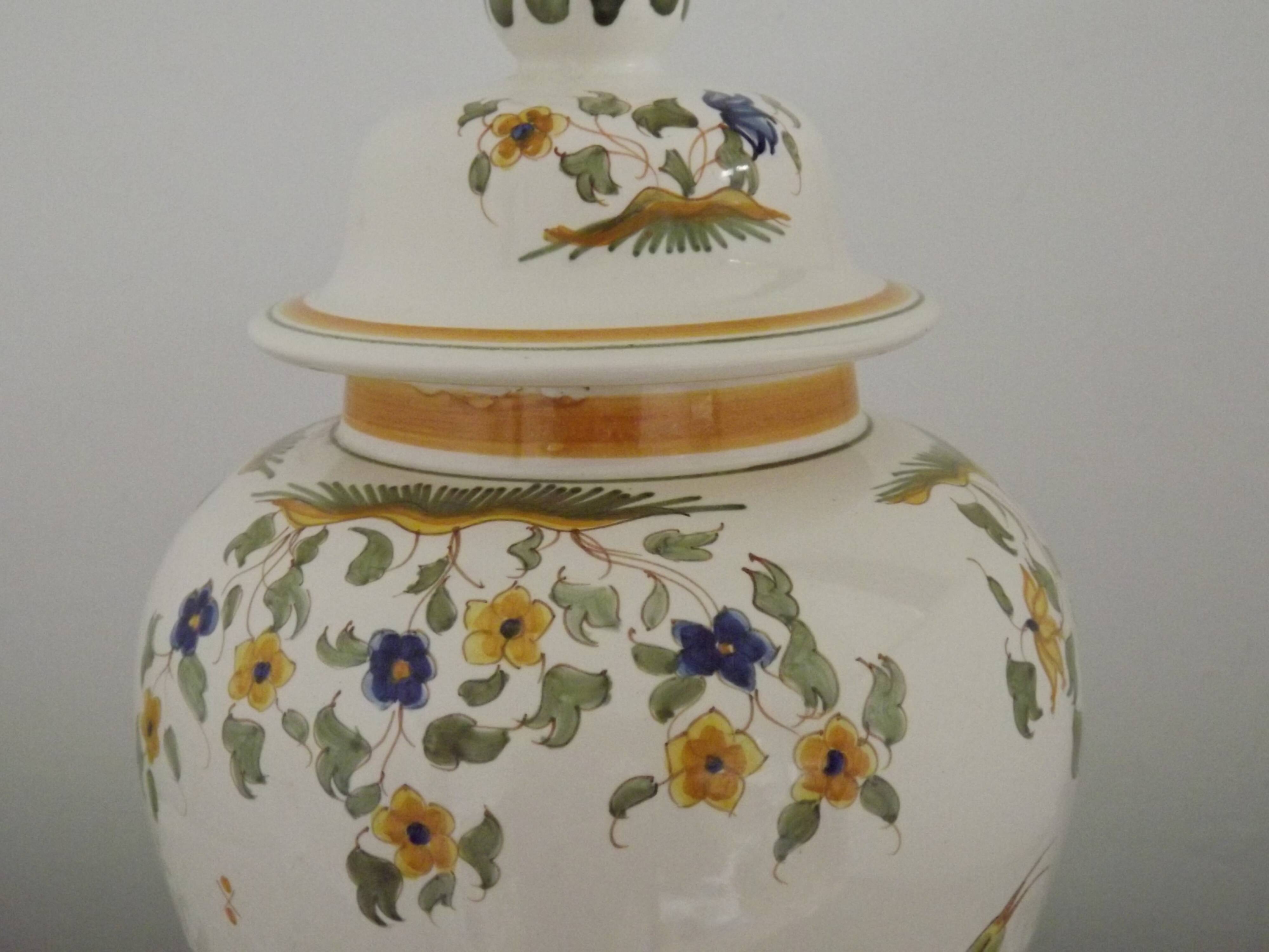 Table lamp with wooden base and fringed shade