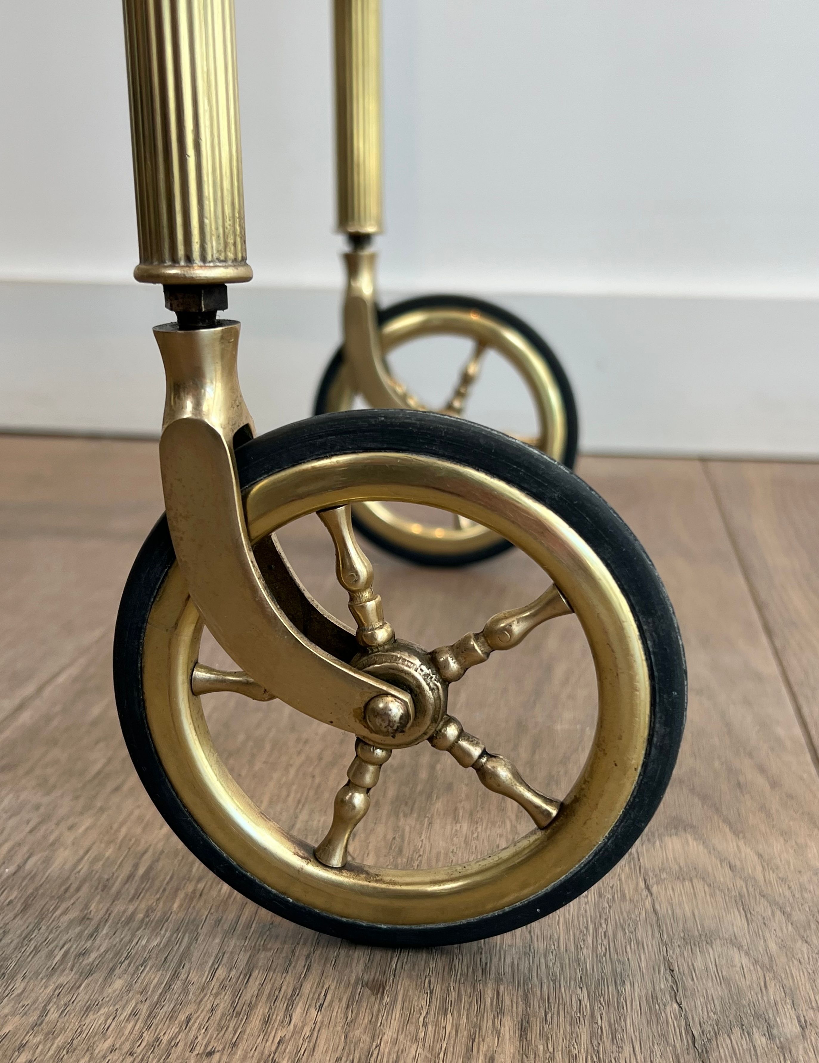 Small oval rolling table in brass with double removable trays from Maison Bagués.