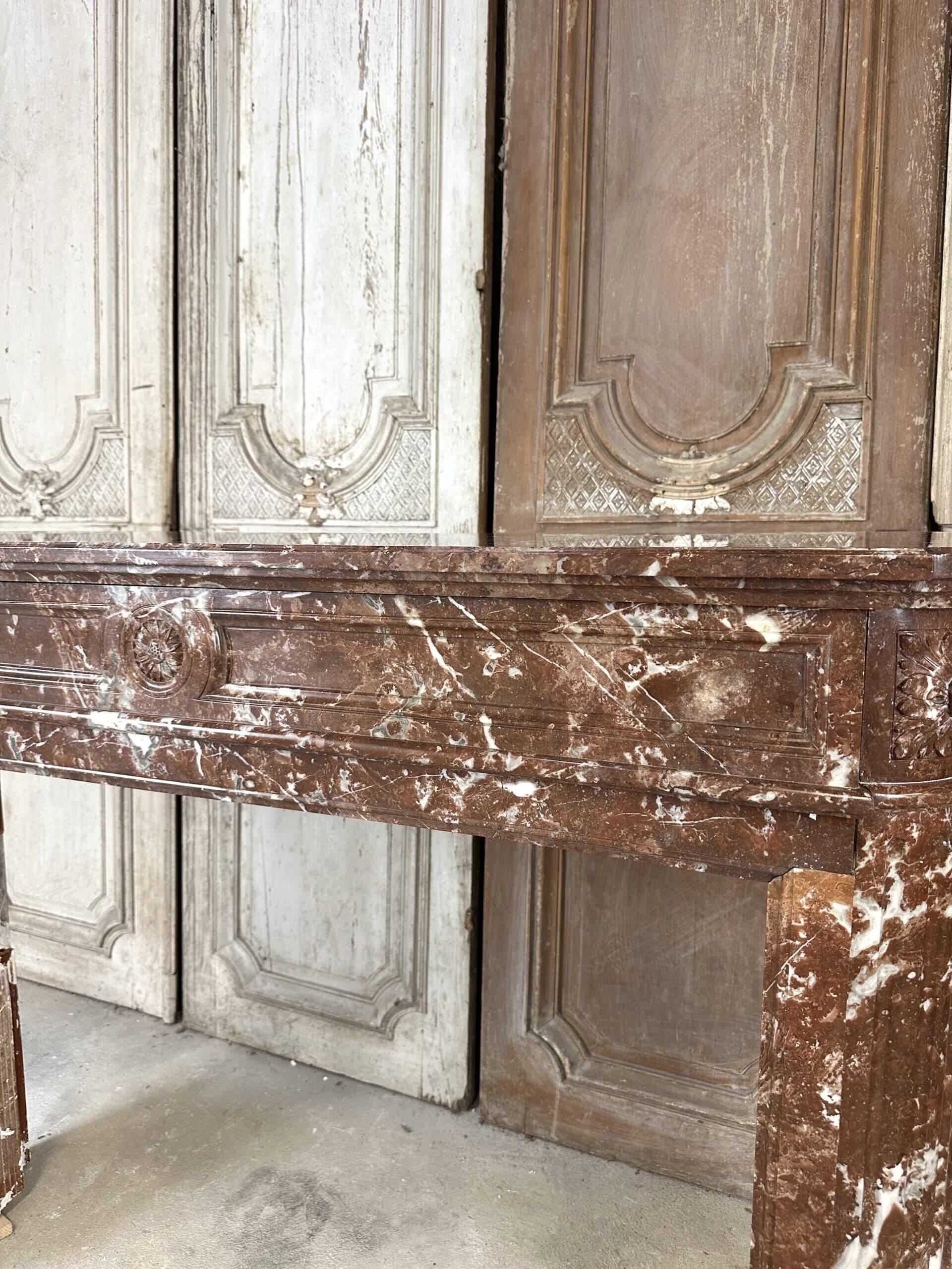 Red marble fireplace in the Louis XVI style, late 19th century