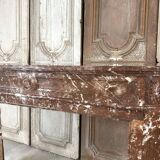 Red marble fireplace in the Louis XVI style, late 19th century