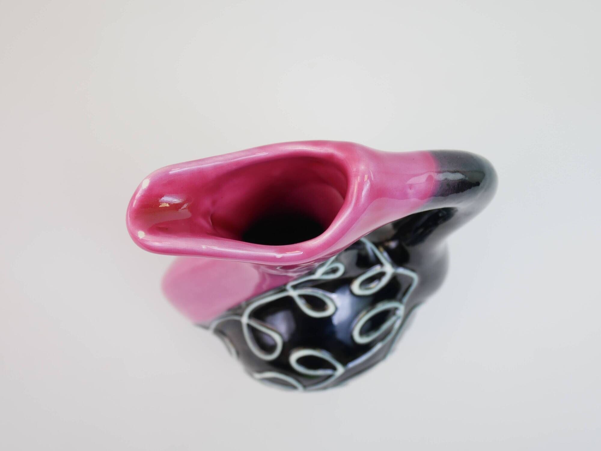 Black and pink Vallauris carafe with white relief patterns