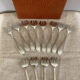 Art Deco oyster forks in punched silver metal, leatherette box