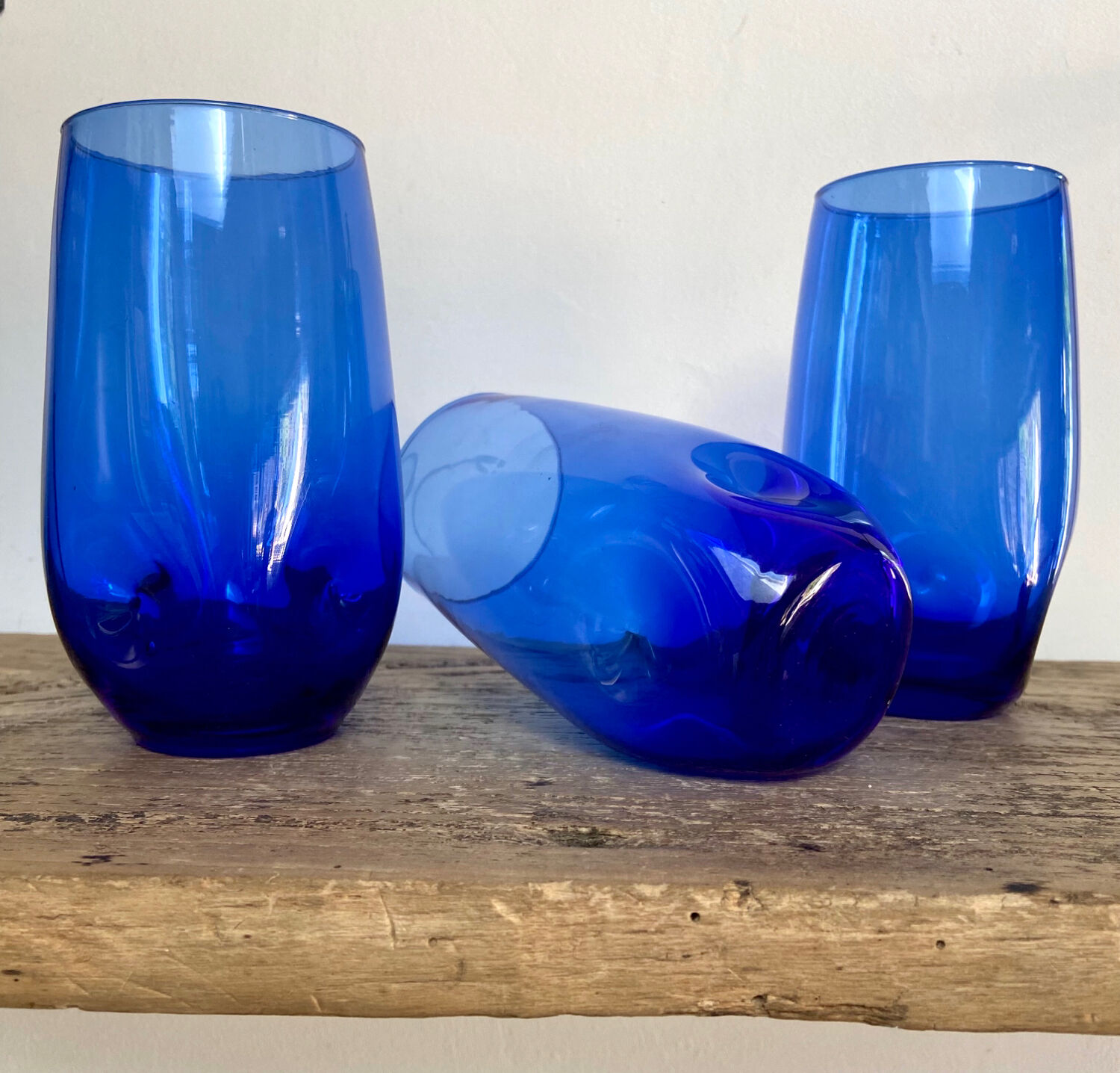 3 blue colored long drink glasses