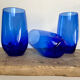 3 blue colored long drink glasses