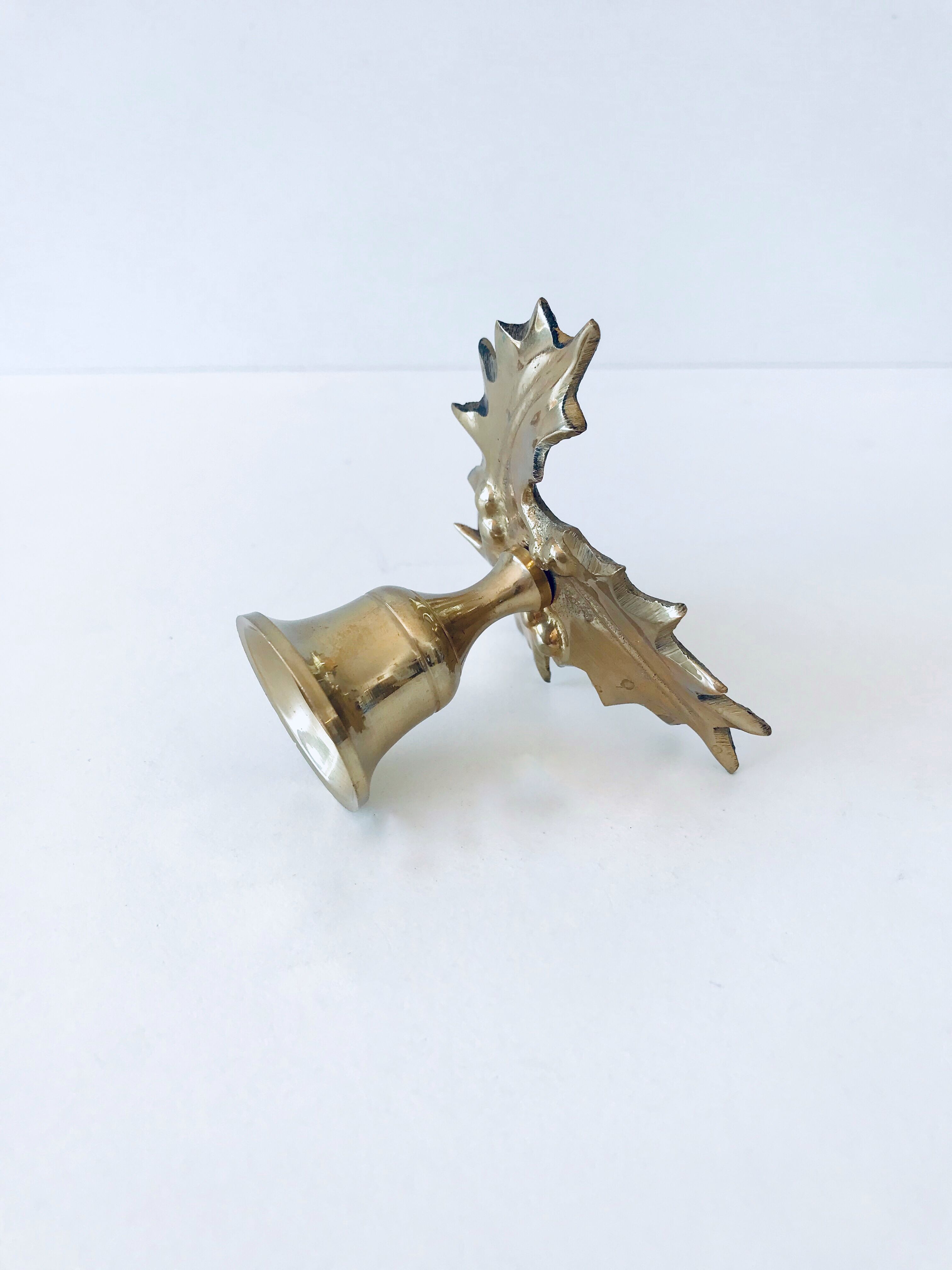 Candlestick in brass holly design