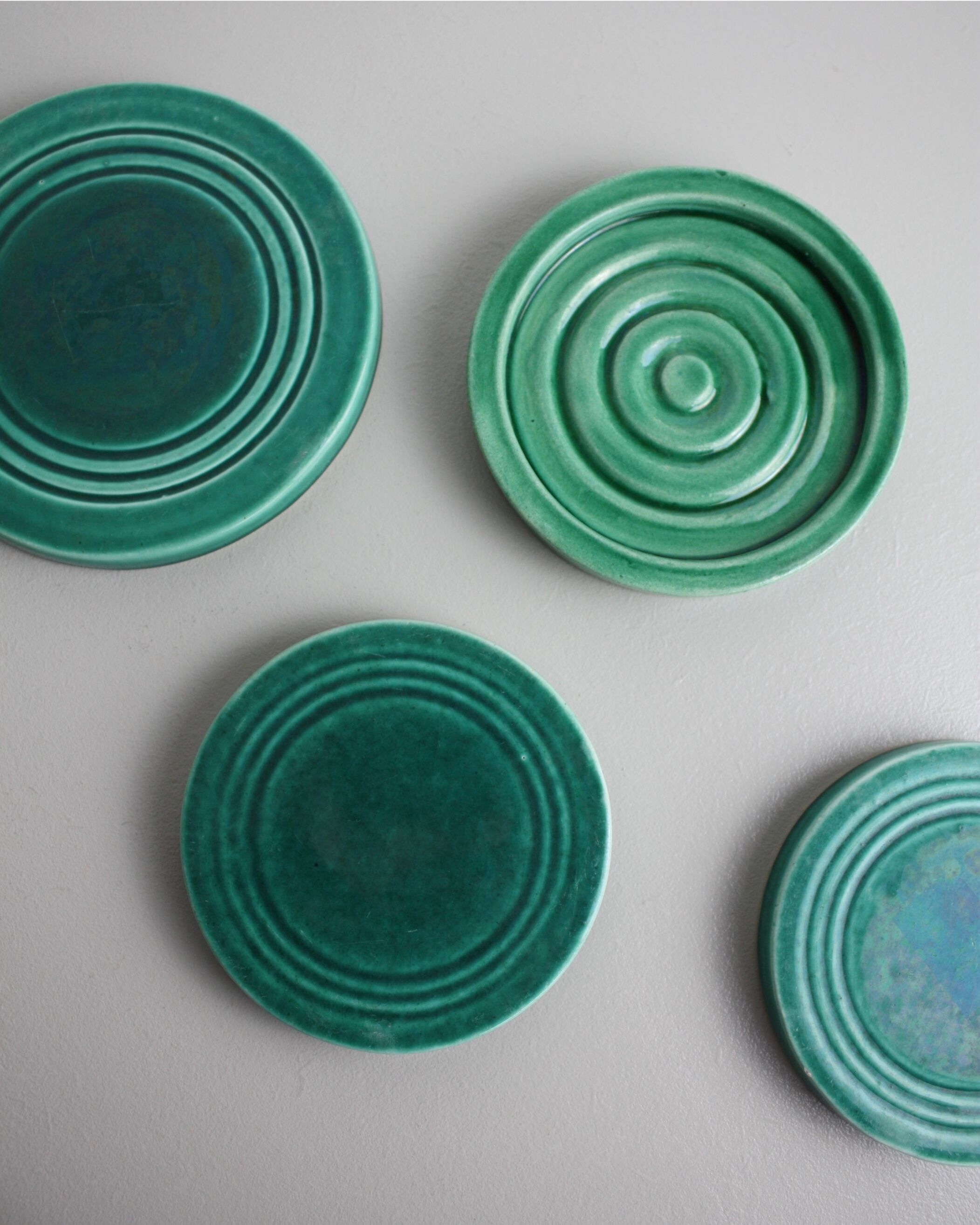Set of 4 coasters in glass in green earthenware
