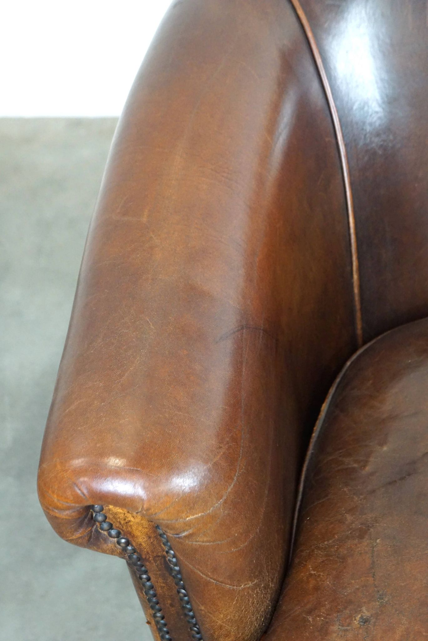 Set of two rugged sheep let of two rugged sheep leather club armchairs with a nice distressed look