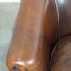 Set of two rugged sheep let of two rugged sheep leather club armchairs with a nice distressed look