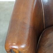 Set of two rugged sheep let of two rugged sheep leather club armchairs with a nice distressed look