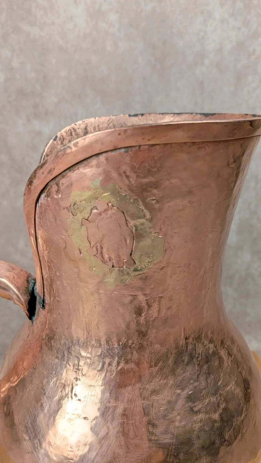Antique hammered copper jug