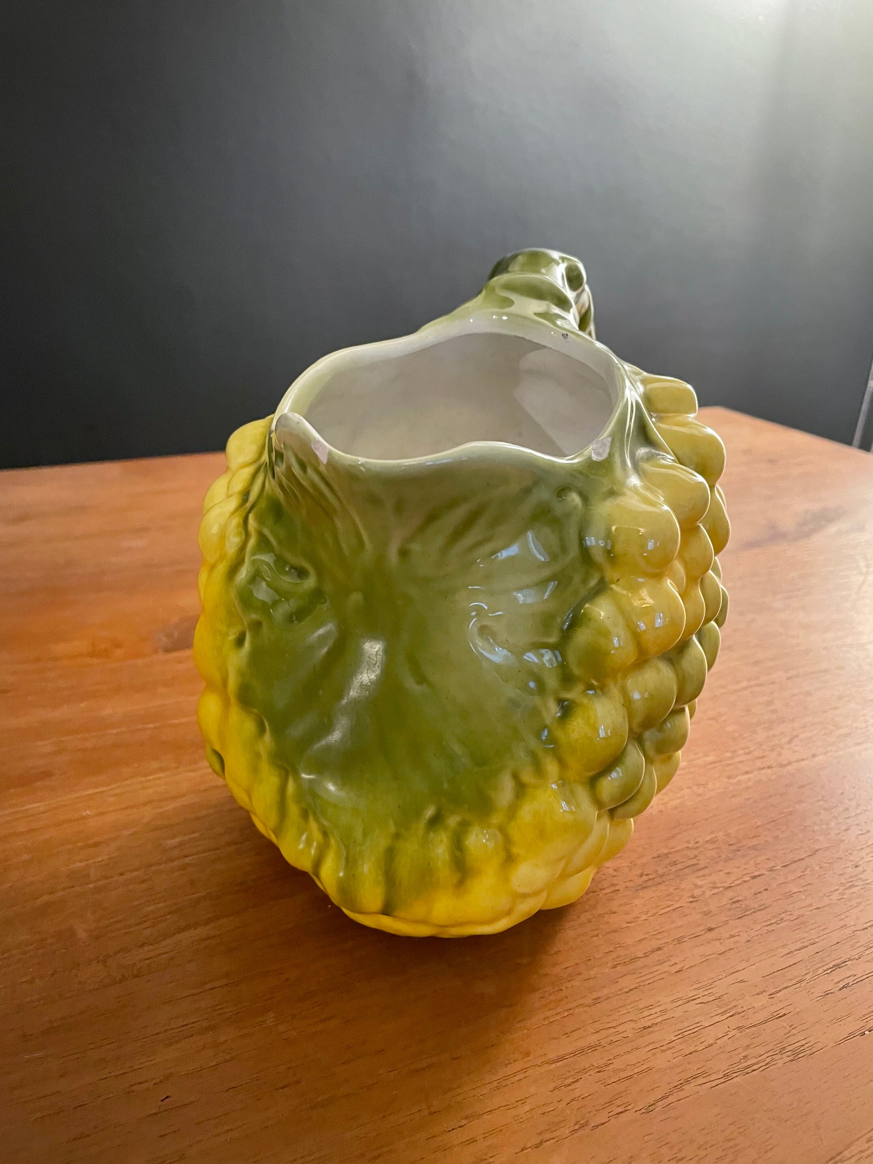 Pitcher bunch yellow and green grape slurry