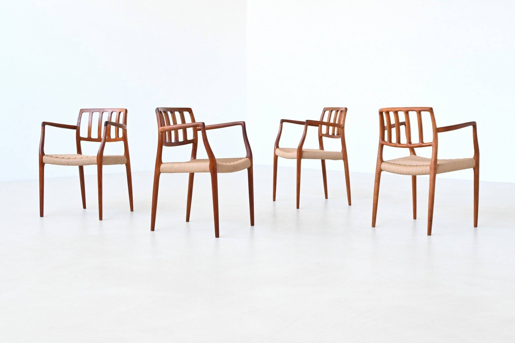 Niels Otto Moller model 66 armchairs teak and paper cord Denmark 1974