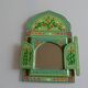 Mirror under shutters with painted flower decoration
