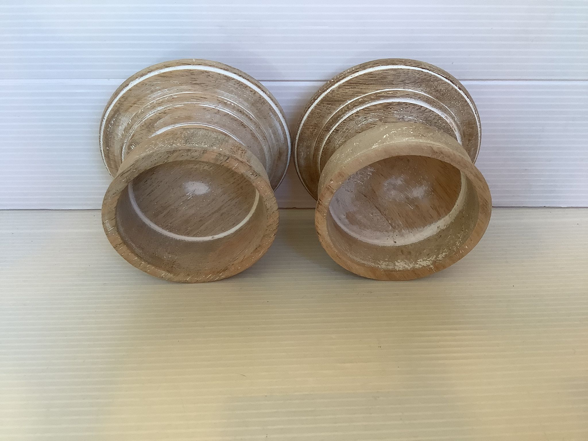 Pair of wooden candlesticks with a white effect