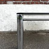 Vintage smoked glass coffee table with chrome structure.